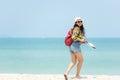 Happy traveler and tourism women travel summer on the beach.ÃÂ 